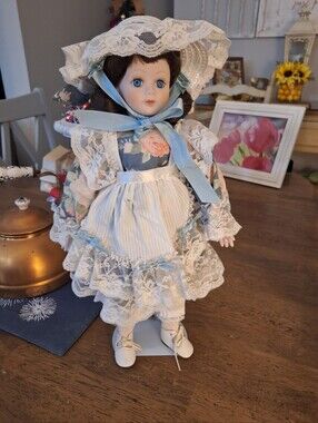 Vintage-Style Porcelain Doll in Blue Floral Dress with Lace Hat